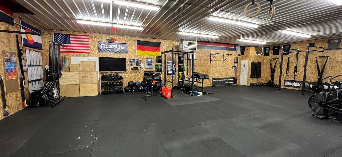 The ranch gym, with Colorado, American and German flags on the wall