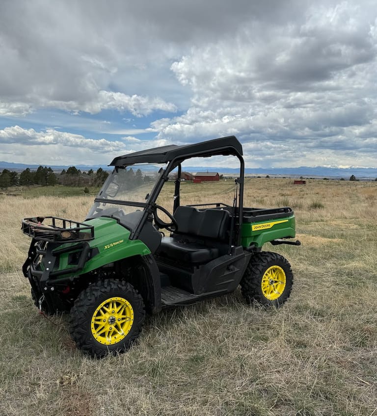 The John Deere Gator out in the pasture